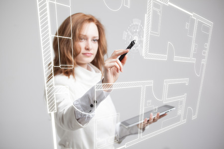 Young woman architect working with a virtual apartment plan