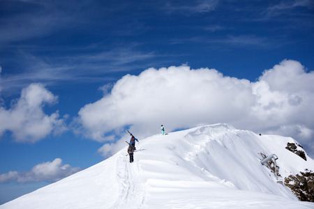 Skiers walking uphill for freeride, extreme sportの写真素材