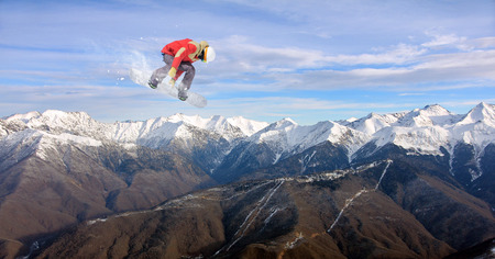 flying snowboarder on mountains. Extreme winter sportの写真素材
