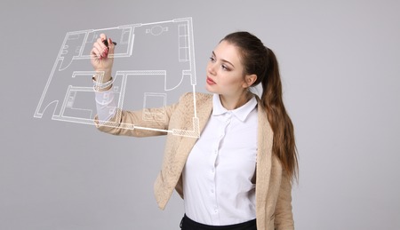 Young woman architect working with a virtual apartment plan