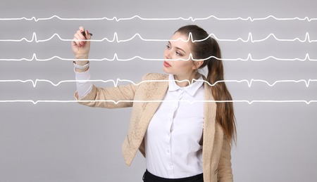 young doctor woman and cardiogram lines in airの写真素材