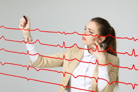 young doctor woman and cardiogram lines in airの写真素材