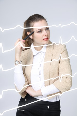 young doctor woman and cardiogram lines in air