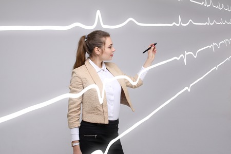 young doctor woman and cardiogram lines in airの写真素材