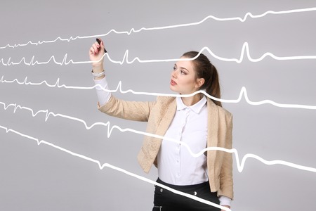 young doctor woman and cardiogram lines in air