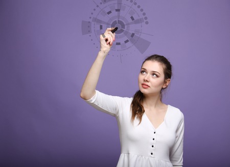 Future computer technology. Woman in white dress working with futuristic interface on violet background.の写真素材
