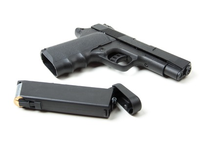 Isolated disassembled gun on white background