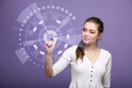 Future computer technology. Woman in white dress working with futuristic interface on violet background.の写真素材