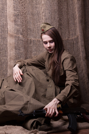 Young woman in Russian military uniform. Female soldier during the second world war.の写真素材