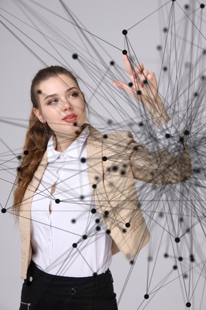 Global network connection concept, woman working with futuristic computer interface on violet background.の写真素材