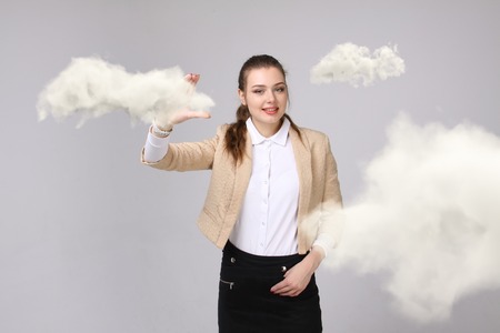 Young businesswoman and cloud, cloud computing conceptの写真素材