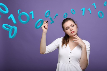 Young woman working with binary code, concept of digital technology.の写真素材
