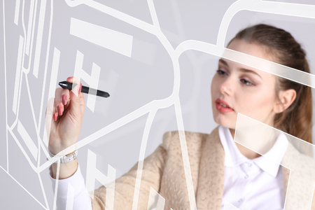 Future technology, navigation, location concept. Woman with stylus showing transparent screen with gps navigator map. Grey background.の写真素材