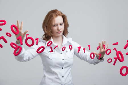 Woman working with binary code, concept of digital technology.の写真素材