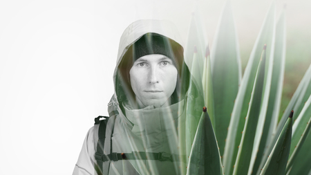 Face of young man hiker and green plant succulent. Double exposure effect photography.の写真素材