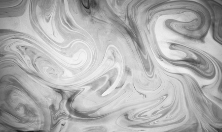 Abstract monochrome marble background. Stains of paint on the water. Ebru art, marbled paper.の写真素材