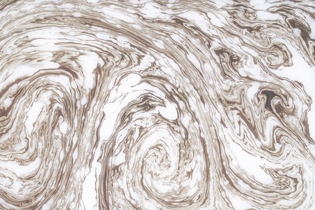 Abstract monochrome marble background. Stains of paint on the water.