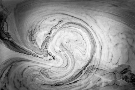 Abstract monochrome marble background. Stains of paint on the water.の写真素材