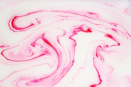 Abstract colored marble background. Stains of paint on the water.