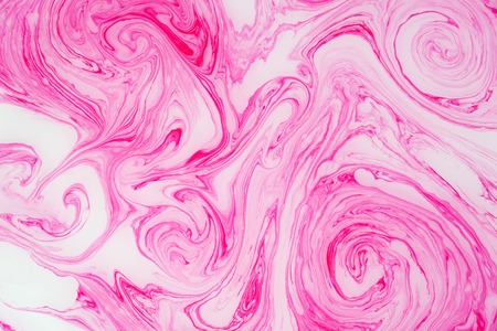 Abstract colored marble background. Stains of paint on the water.の写真素材