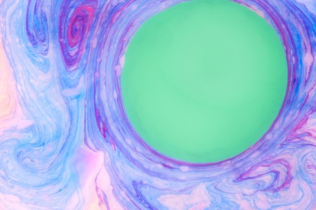 Abstract colored marble background. Stains of paint on the water.の写真素材