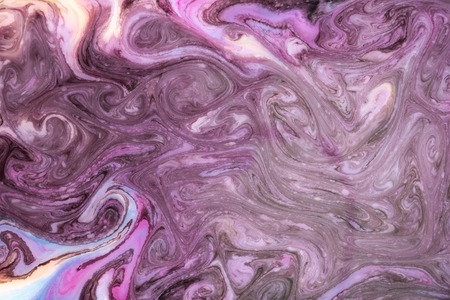 Abstract paint ink, psychedelic background. Colorful spots on water surface.の写真素材