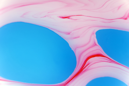 Abstract background. Stains of paint on the water.の写真素材