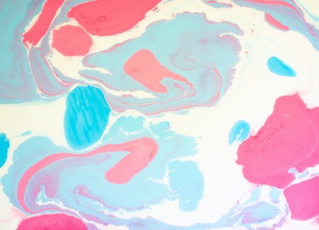 Abstract colored background. Stains of paint on the surface of the water. Ebru art, marbled paper.