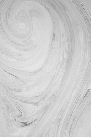 Abstract monochrome marble background. Stains of paint on the water.の写真素材