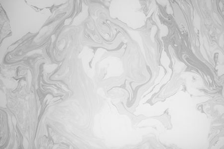Abstract monochrome marble background. Stains of paint on the water.の写真素材