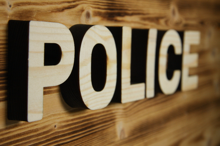 POLICE word made with building blocks on wooden boardの写真素材