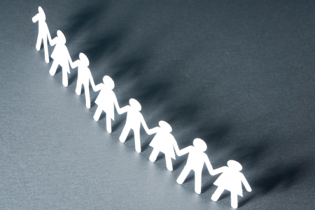 Raw of paper people rallying as in protest or demonstration, concept. Activism, social movement.の写真素材