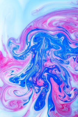 Abstract colored background. Stains of paint on the water. Ebru art, marbled paper.の写真素材