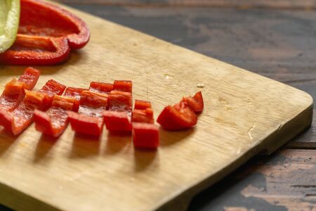 Sliced red and green bell peppers on a cutting board. Organic food and coocking.の写真素材