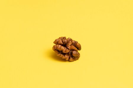 Delicious walnuts on yellow background.の写真素材