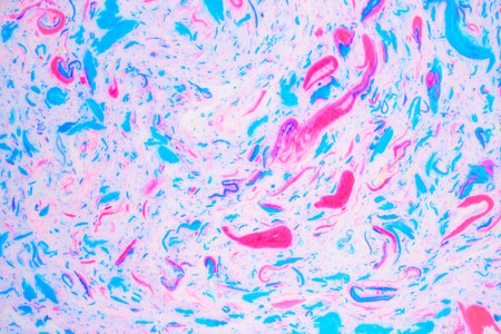 Variegated colored background, paint particles on white. Dye stains on the surface of the liquid. Abstract background.の写真素材