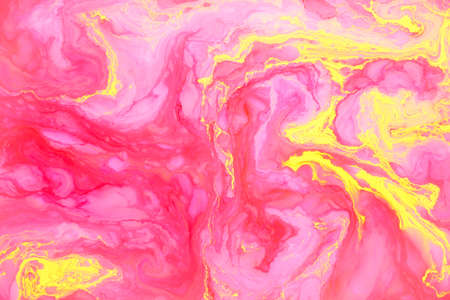 Abstract colored marble background, stains of pink and yellow paint on the surface of the water. Liquid colorful backdrop.の写真素材