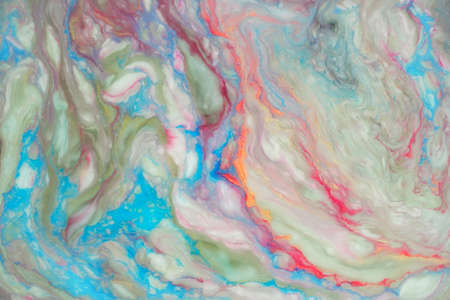 Liquid marbling paint background. Fluid painting abstract texture. Mix of acrylic vibrant colors.の写真素材
