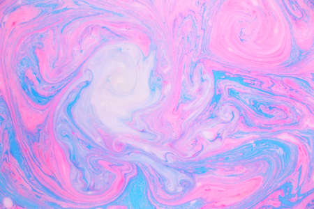 Abstract paint ink, psychedelic background. Colorful spots on water surface.の写真素材