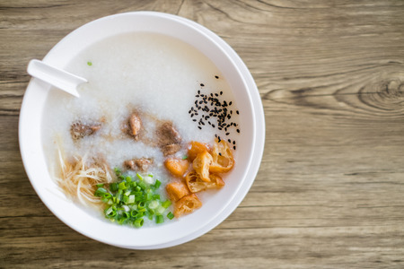 Thai style rice boiled with pork in bowlの写真素材