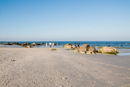 Prachuap Khiri Khan, Thailand - Dec 25: Tourists enjoy the sunny weather and relaxing at Huahin beach on Dec 25, 2016 in Prachuap Khiri Khan, Thailandのeditorial素材