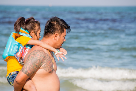 Prachuap Khiri Khan, Thailand - Dec 25: people enjoy on the beach at Hua Hin on Dec 25, 2016 in Prachuap Khiri Khan, Thailandのeditorial素材