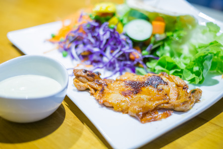 Grilled Chicken salad in white plate - Healthy food styleの写真素材