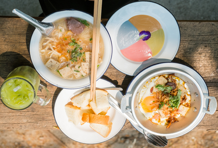 Thai food set consist of Steamed bread with colourful thai custard,Iced matcha tea,Vietnamese Pork...