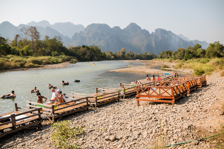 Vangviang, Laos - Feb 18 :Unidentified tourists rest in riverfront restaurant on Feb 18, 2017 in Vangviang, Laosのeditorial素材