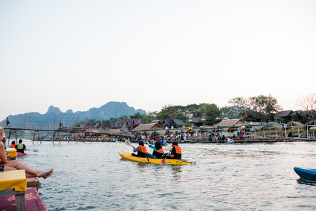 Vangviang, Laos - Feb 18 :Unidentified tourists are rowing kayak boats in Song River on Feb 18, 2017 in Vangviang, Laosのeditorial素材