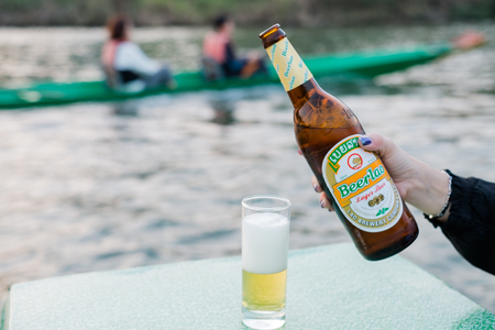 Vangviang, Laos - Feb 18 :Beer Laos is lifted by hand with local riverside restaurant on Feb 18, 2017 in Vangviang, Laosのeditorial素材