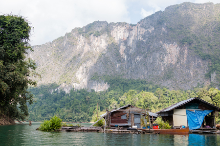 Tropical lakeside hut in ratchaprapa dam or Cheow Lan Dam Suratthani, Thailand.の写真素材