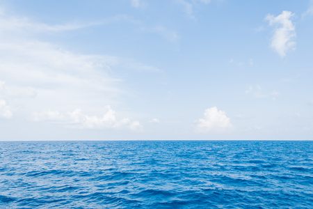 Calm Sea and Blue Sky Background in Maldivesの写真素材