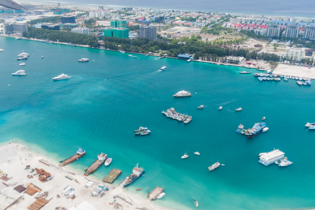 Scenery above the blue ocean from airplane window Maldives islandの写真素材